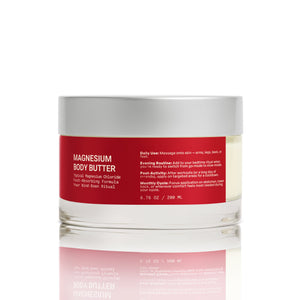 Jar of magnesium body butter with a red label on a white background